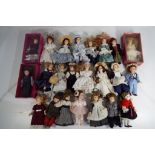 Twenty three collectors cabinet ceramic dolls in varying costumes