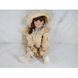 Cabinet Doll - a bisque headed cabinet size dressed doll with glass eyes,