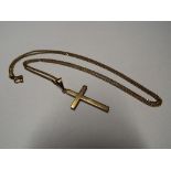 A 9 carat yellow gold diamond cut curb chain with 9 carat gold cross, both stamped 9k,