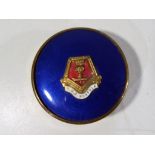 A powder compact with blue enamel lid marked with crest for HMS Norfolk, verso marked metal,
