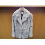 A grey fur coat fully lined, approx length 68cm, slip pockets,