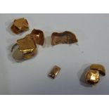 A small collection gold cap fillings approximate weight 3.59 g.