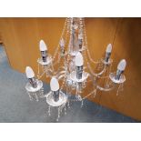 A large good quality glass nine armed chandelier with full glass droplet detailing Est £50 - £80