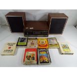 A solid state 8 track stereo tape player with speakers and 8 cassettes to include Leo Sayer,