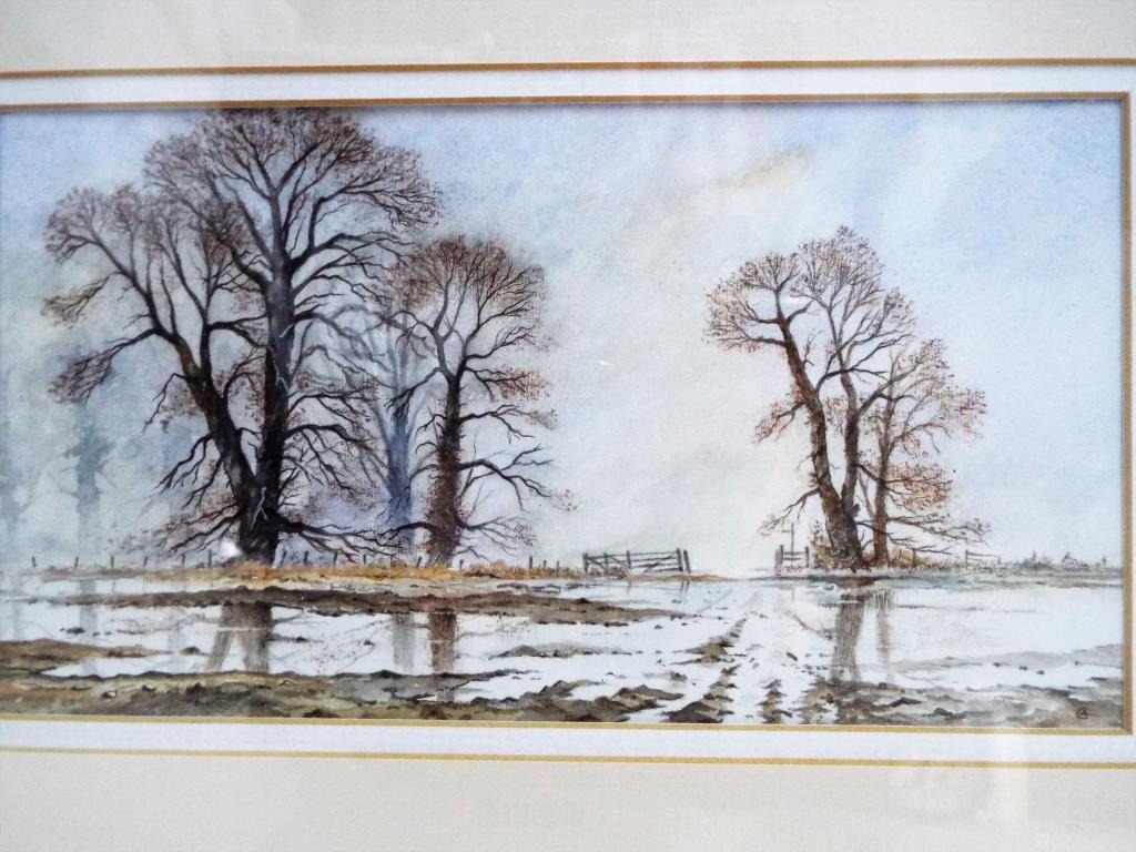 A watercolour mounted and framed under glass depicting a village scene signed lower right by the - Image 4 of 4