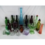 A good quantity of glassware to include vintage bottles, art glass, uranium glass and similar.