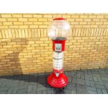A large illuminating Wizard bubble gum machine operated with a 20 pence coin to vend gum balls,