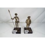 Two cast metal figurines on black marble plinths marked Style Bronze the largest approx 19.