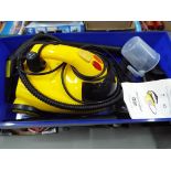 A Little Yell O Steam Cleaner with manual and attachments,