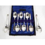 Eight George V coffee spoons with handles decorated with golf clubs, eight spoons in total,