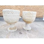 Garden - a pair of round reconstituted stone planters on stands with scroll work decoration and