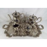 A silver plated tea and coffee set comprising salver, coffee pot, tea pot, cream jug and sugar bowl.