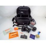 Photography - a Pentax P30 contained in a faux leather travel case by Corniche together with a
