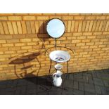An iron wash stand with mirror,