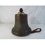 A large brass bell approximately 27 cm (h) x 25 cm (d).