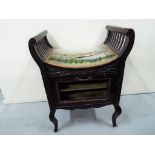 A Victorian piano stool with tapestry seat depicting a harbour scene