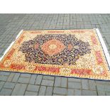 A Keshan carpet with a blue ground,