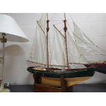 A large twin masted pond yacht of wooden construction approximately 110 cm [h] including masts,