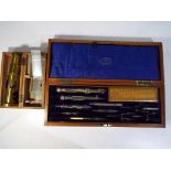 A wood cased Lilley & Son technical drawing set with lift out compartments,