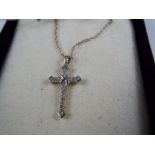 A 9ct gold cross and chain, stone set approx weight 1.