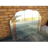 An Art Deco bevel edged wall mirror with floral decoration approx 92cm x 121cm