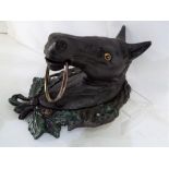 A large cast iron door knocker in a form of a horses head, approximately 28 cm x 19 cm x 15 cm,