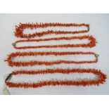 Coral - four graduated coral beaded necklaces.