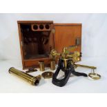 A scientific microscope in fitted mahogany case with internal drawer,