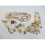 Four silver gilt necklaces together with five silver gilt bracelets.