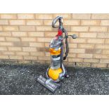 Dyson - a Dyson DC24 upright vacuum cleaner (yellow and grey)