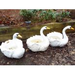Three garden planters in the style of swans,