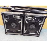 Coltec Sound Systems - a pair of speakers in cabinets with trees (speaker stands) and two jack