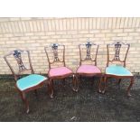 Four upholstered oak chairs