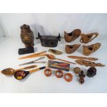 A mixed lot of collectables containing a quantity of treen to include carved wooden jugs,