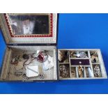 A jewellery box containing a quantity of vintage costume jewellery to include brooches, tie pin,