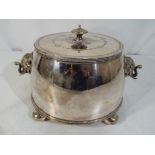 A good quality white metal lidded jar raised on four bun feet with two elephant mask handles,