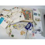 A stamp album containing a quantity of UK and Worldwide postage stamps,