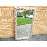 A good quality bevel edged mirror, in a silver coloured frame,