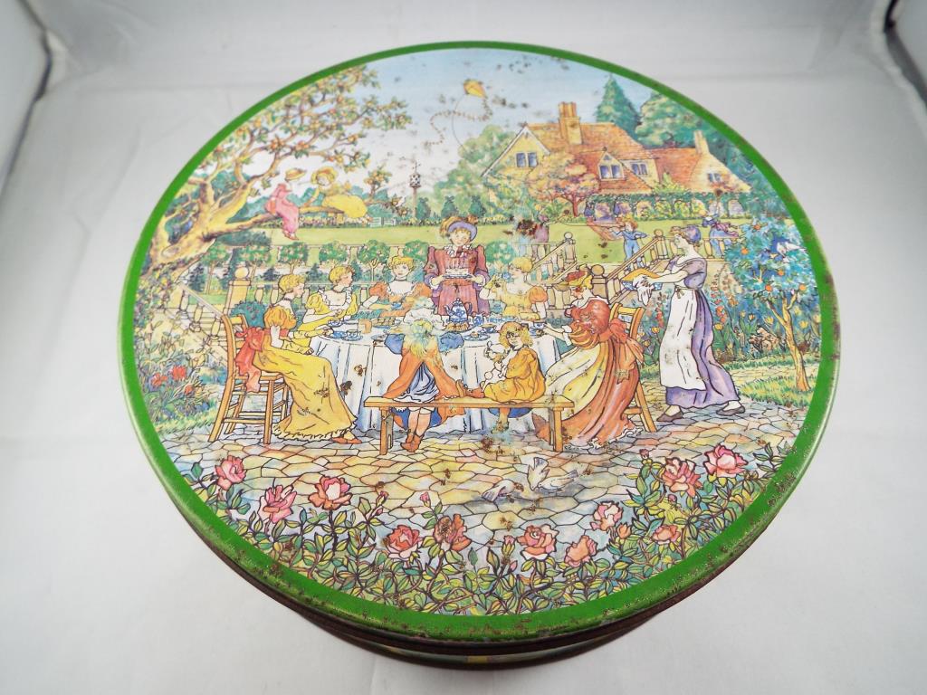 A Huntley & Palmer risque biscuit tin,