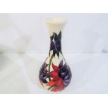 A Moorcroft vase in the Ruby Red pattern, approximate height 17 cm (h).