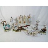 A lot to include a quantity of European ceramic figurines, including Capodimonte, Sitzendorf,