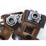 An Eljy Lumiere camera, cased and an Agfa camera.