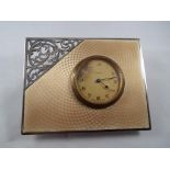 A George V hallmarked silver framed 8 day clock with Swiss movement, the frame,