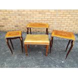 A nest of three tables with inlaid decoration and brass mounts,