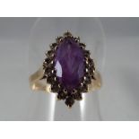 A lady's 9 carat yellow gold cz and Amethyst marquise shaped cluster ring, approx 2.