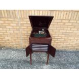 A vintage gramophone in cabinet approx 85cm x 48cm x 61cm with a large collection of 78's records,