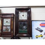 An 8-day American Ogee wall or shelf clock, the case having mahogany veneer and two opening doors,