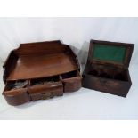 A wooden desk organizer with a small wooden storage chest,