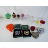 A collection of paperweights to include Caithness, Isle of Wight glass,