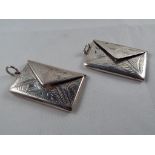 Two silver twin-section stamp envelopes, marked .925, each measuring 2.7 cm x 4.
